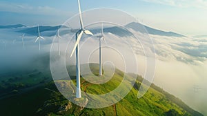 Wind turbine renewable energy windfarm with windmills aerial view with fog in green field