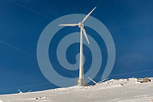 Wind turbine and snow in the Alps, Switzerland