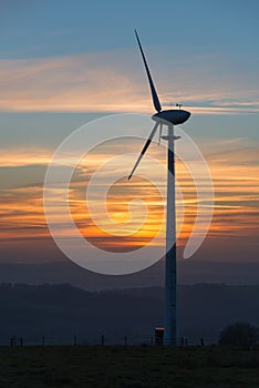 Wind turbine at sunset