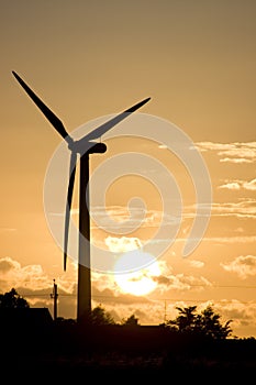 Wind turbine at sunset