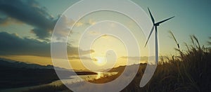 Wind turbine sunset landscape with river and mountains