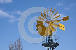 Wind turbine, with the yellow blades producing energy photo