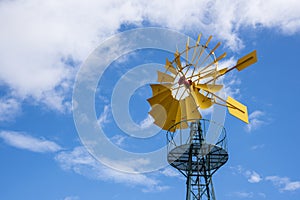 Wind turbine, with the yellow blades producing energy photo