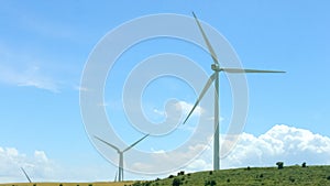 Wind turbines against amazing blue sky background, alternative energy innovation