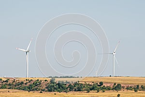 Wind turbines in an arid landscape. An alternative way of generating electricity