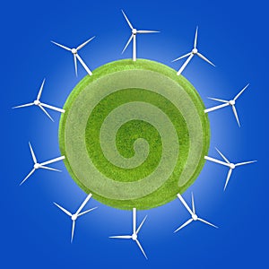 Wind turbines around a green planet symbolizing clean energies. photo