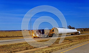 Wind turbines blade on trailer transporting wing the farm