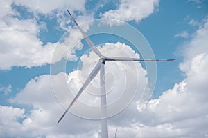 Wind turbines and blue skies and white clouds