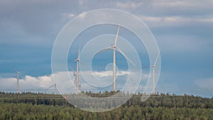 Wind turbines, converting the wind`s kinetic energy into electrical energy - ecologically clean source of energy.