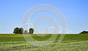 Wind turbines in countryside landscape