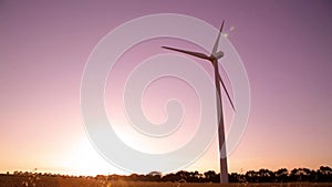 Wind turbines in the countryside under a beautiful sunset