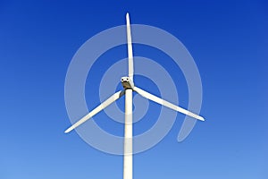 Wind turbines creating renewable energy on windfarm