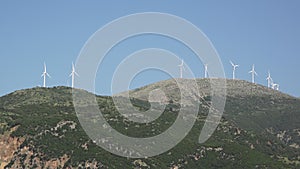 Wind turbines on a distant mountain