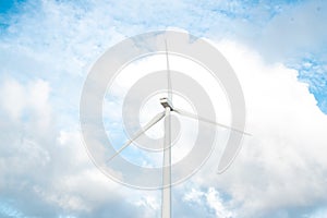 Wind turbines. Ecology wind against cloudy sky background with c