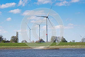 Wind Turbines on the Elbe with Farm house in Lower Saxony, Germany