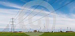 Wind turbines and electricity pylons photo