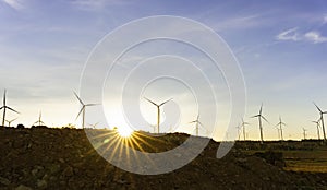 Wind turbines farm is an alternative electricity source, Concept of sustainable resources, Beautiful orange sunlight in summer