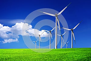 Wind turbines farm on blue sky