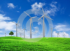 Wind turbines farm on green field