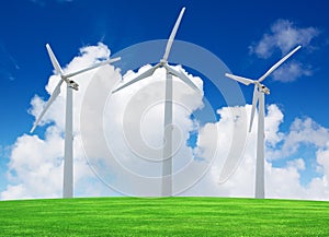 Wind turbines farm on green field