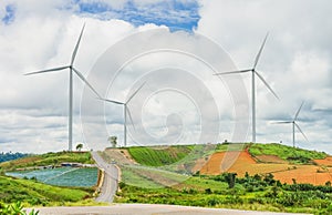 Wind turbines farm on hill in rural area