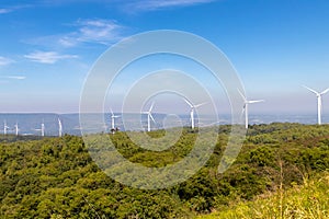 Wind turbines farm on mountanis landscape at Lam Takong Reservoir Views against blue sky with clouds background,Windmills for