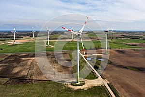 Wind turbines farm on sunset in spring