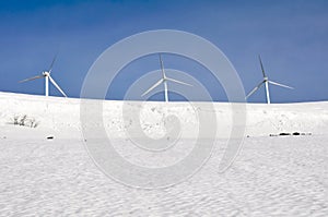 Wind turbines farm in winter, Alava (Spain) photo