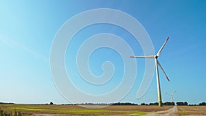 Wind Turbines In Farmer's Field