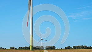Wind Turbines In Farmer's Field