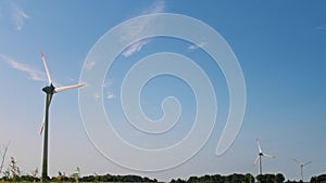 Wind Turbines In Farmer's Field