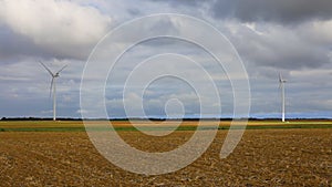 Wind turbines in a field during autumn