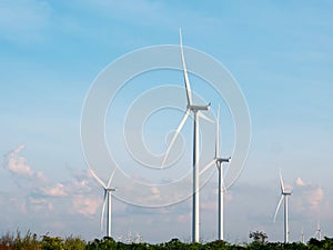 Wind turbines field with blue sky background