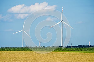 Wind turbines on the field. Renewable energy sources. Electricity generator turbines. Mills on the field. Energy and power.