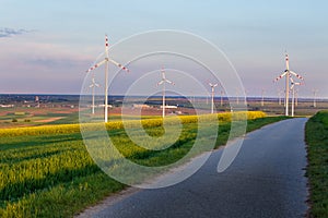 Wind turbines in field in spring time