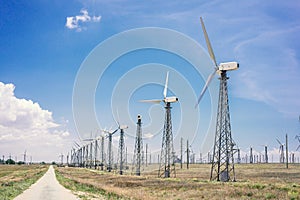 Wind turbines that generate electricity in the fields of Europe.