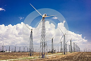 Wind turbines that generate electricity in the fields of Europe.