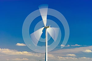 Wind turbines generating electricity in windfarm
