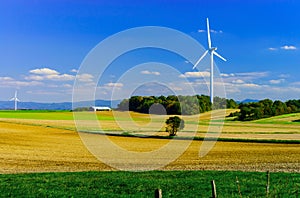 Wind turbines generating electricity in windfarm