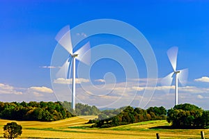 Wind turbines generating electricity in windfarm