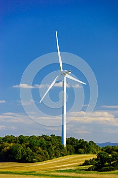 Wind turbines generating electricity in windfarm