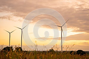 Wind turbines of global ecology with cloud background on the sky. alternative electricity source to be sustainable resources in