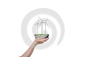 Wind turbines and globe in human hand isolated on white background