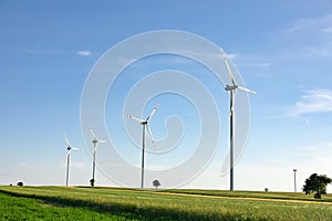 Wind turbines in green field