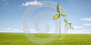 Wind turbines with green leaves as rotors photo