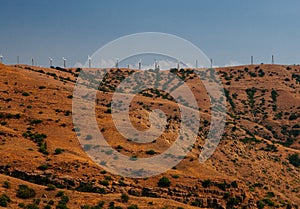 Wind turbines on the hill in the afternoon