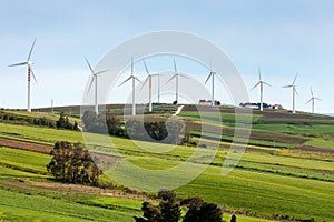 Wind turbines on hilly expanse photo