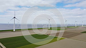 Wind turbines on a levee and offshore producing electricty