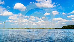 Wind Turbines, the modern Windmills, in a Wind Farm along the Shore of Veluwemeer