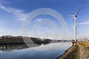 Wind turbines near canal Hartel in Rotterdam